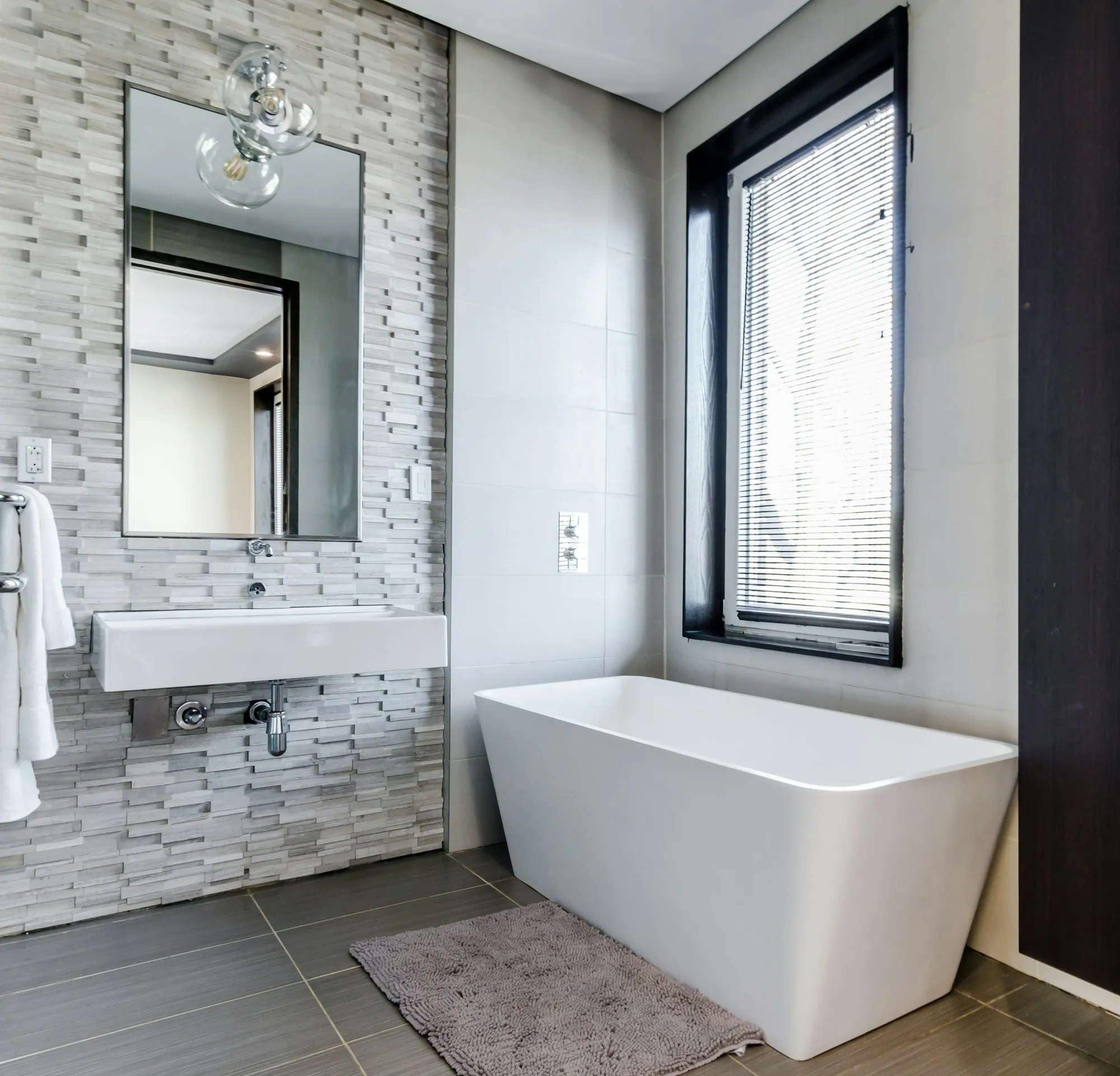 Remodeled bathroom with new tile and fixtures