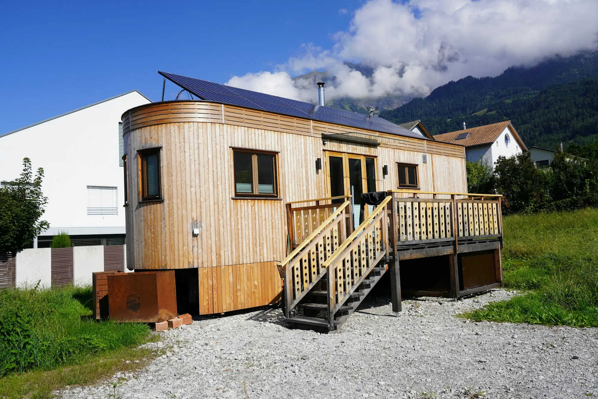Small wood-clad accessory dwelling with a raised deck