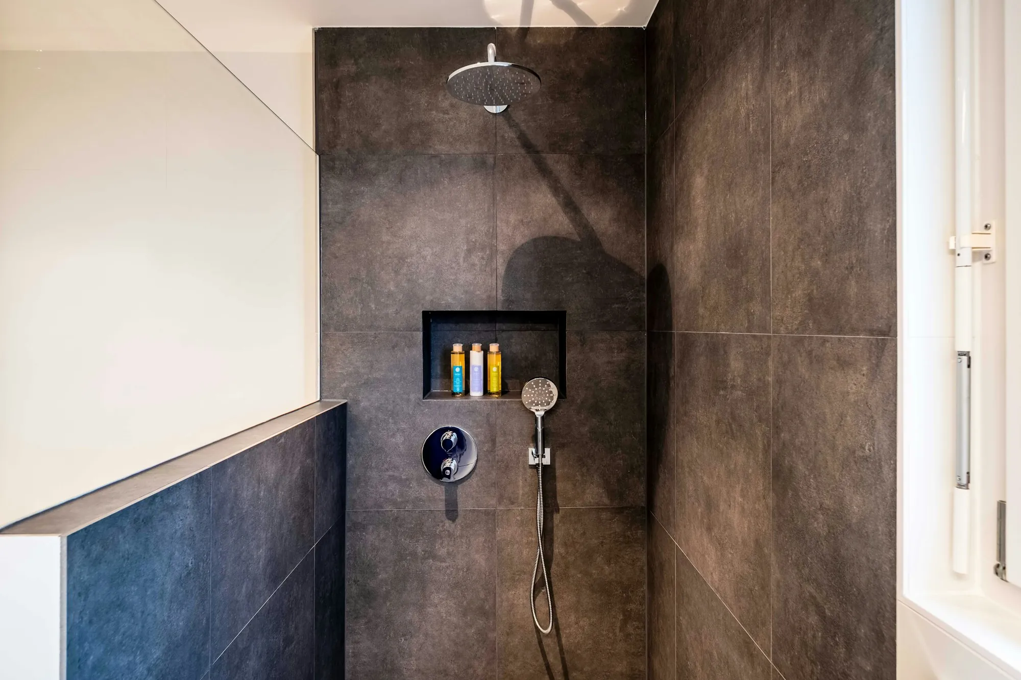 Bathroom interior with a tiled shower area